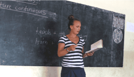 intern teaching inside a classroom in Africa