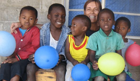 volunteer with community children in South Africa
