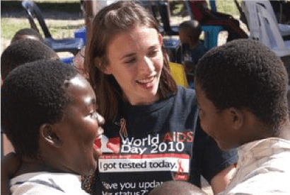 volunteer interacting with local school kids in Africa