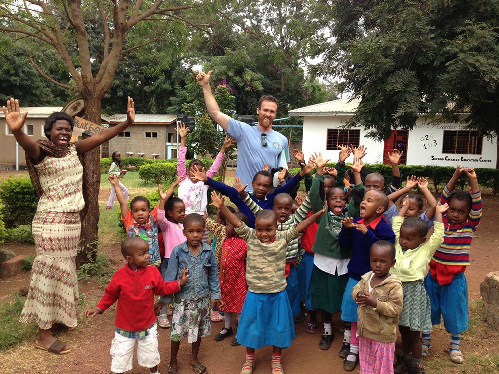volunteer with elementary kids in Africa