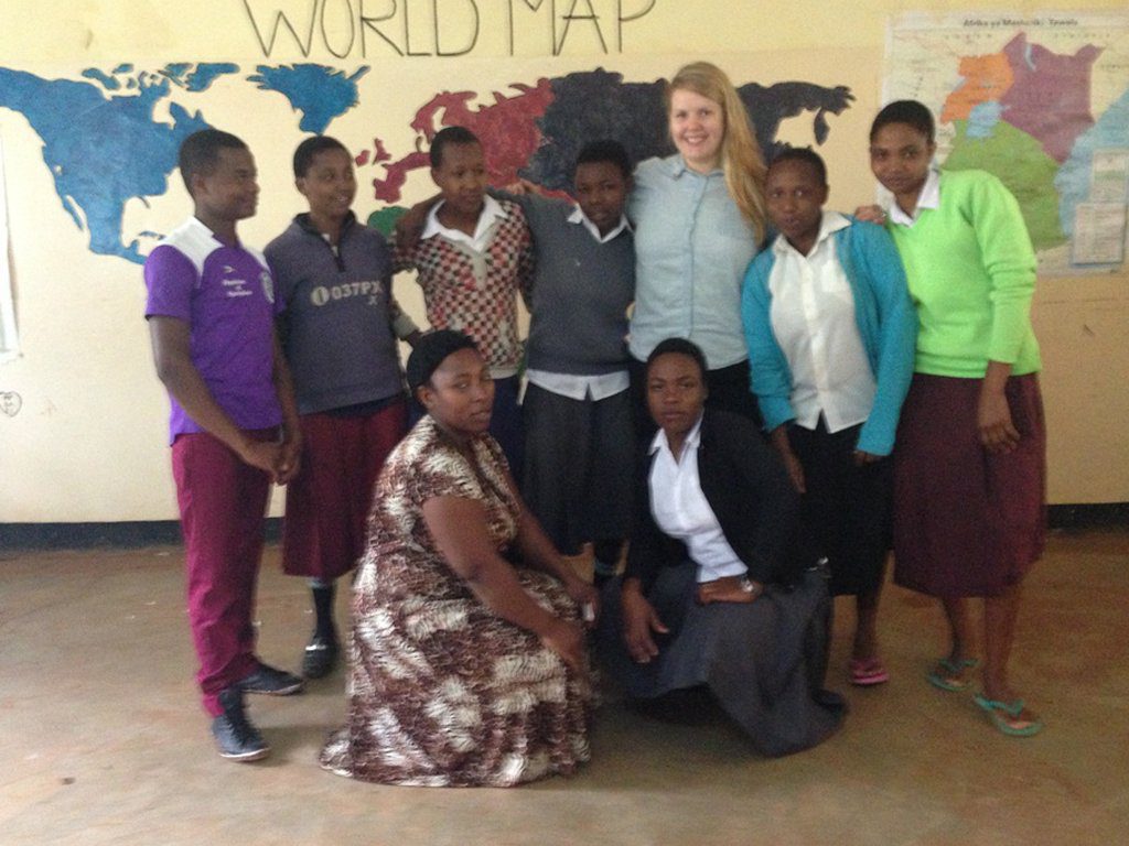 education volunteer with high school students in Tanzania