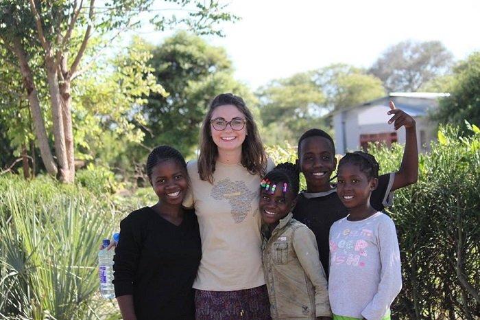 gender equality intern with local kids of Zambia