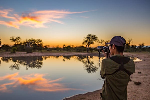 wildlife conservation photography intern taking a photo of the sunset in Africa