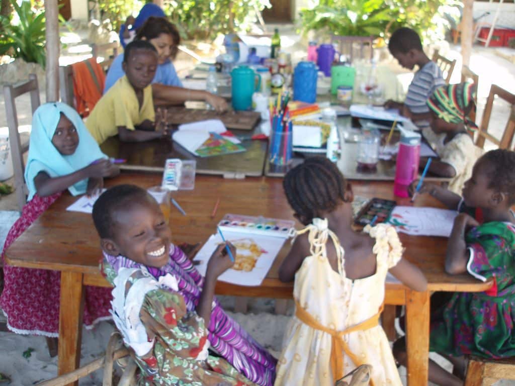 interns teaching arts to kids in Tanzania