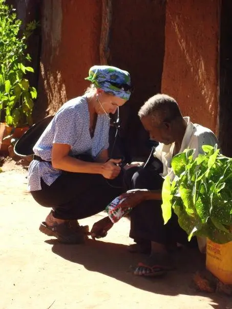 Medical & healthcare volunteer providing medical support to patient.