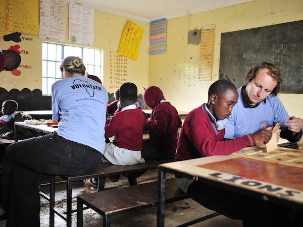 volunteers teaching vulnerable children in Kenya