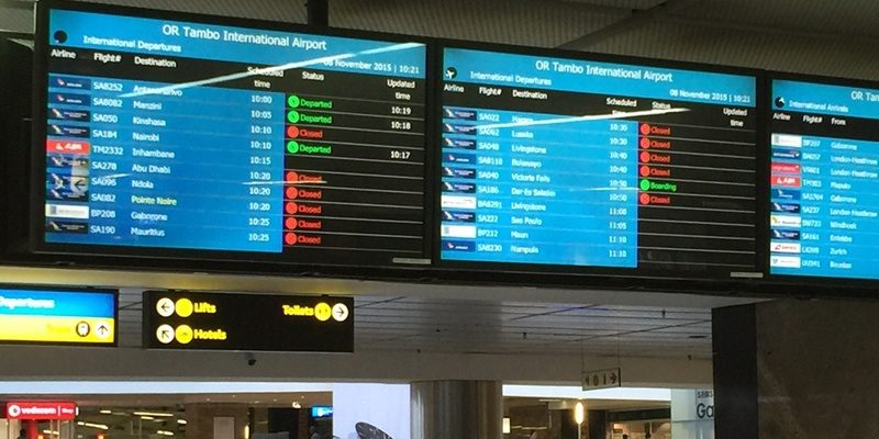 Photo of airport screen that shows arrival times.