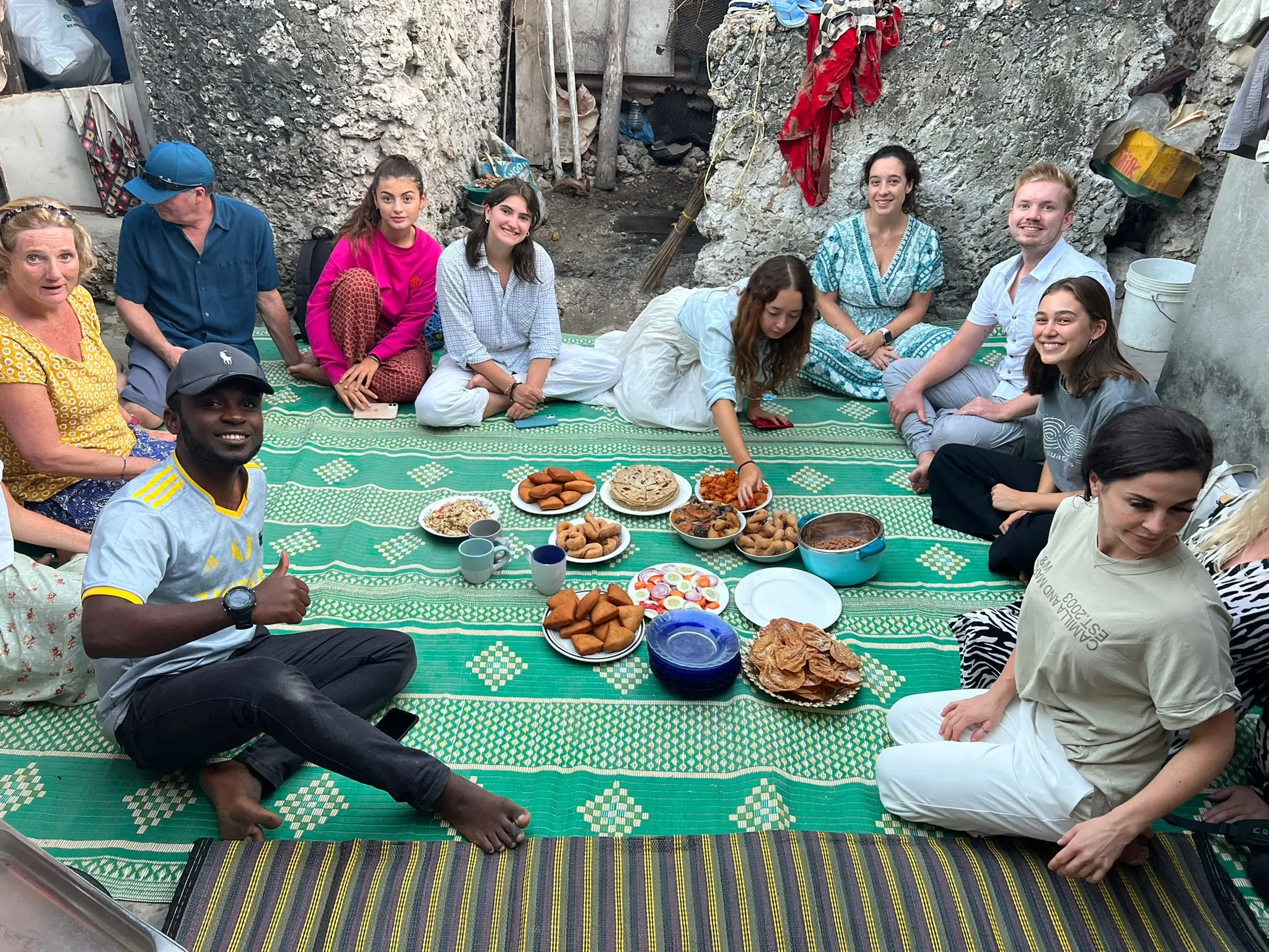 volunteers enjoying a local meal in zanzibar