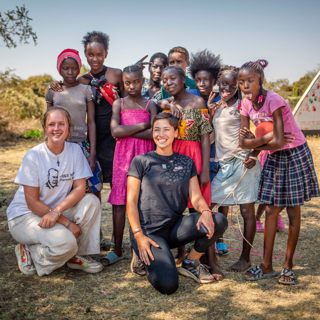 group photo with some local children in zambia