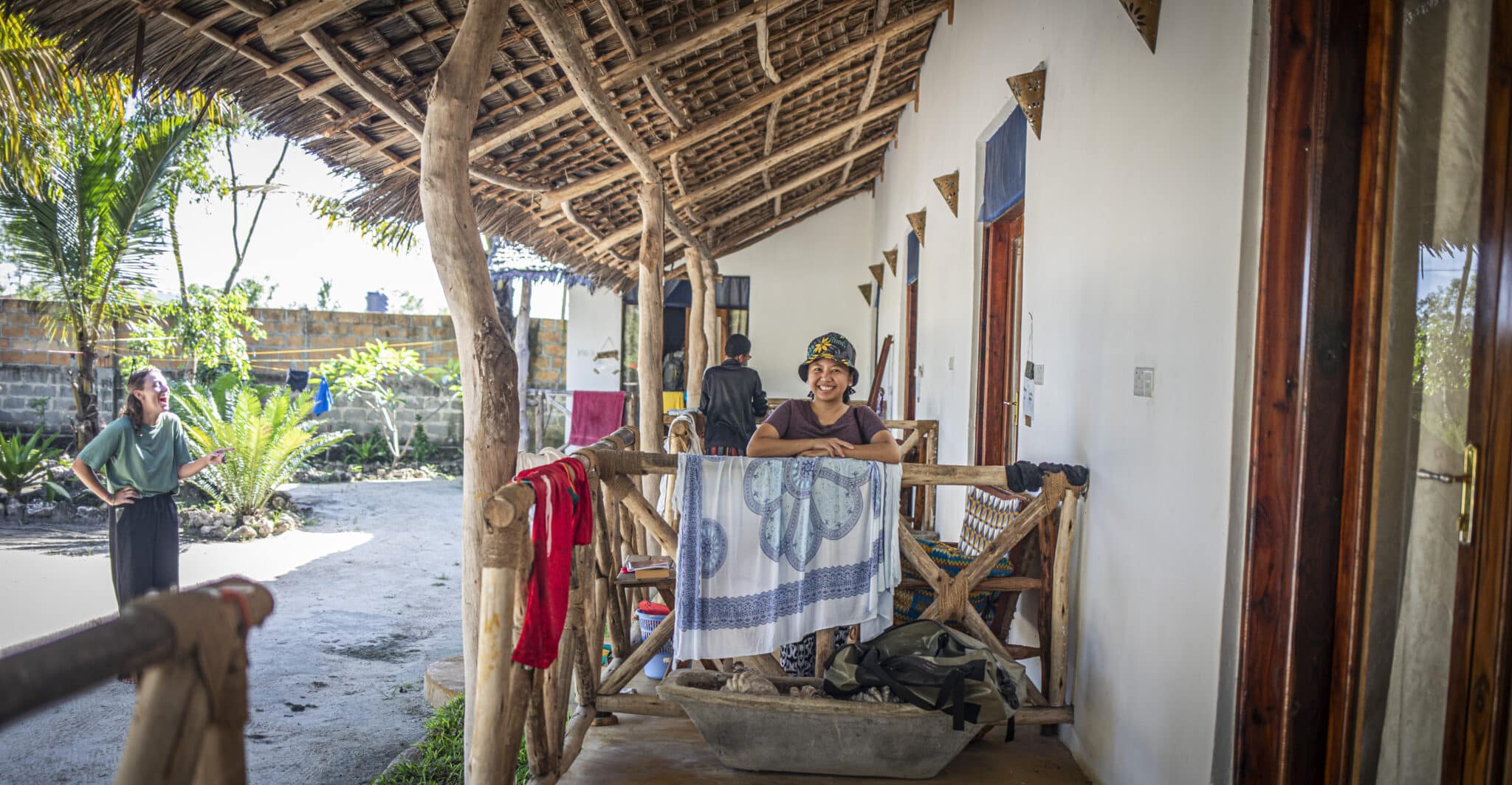 a volunteer standing on a terrace of an accommodation