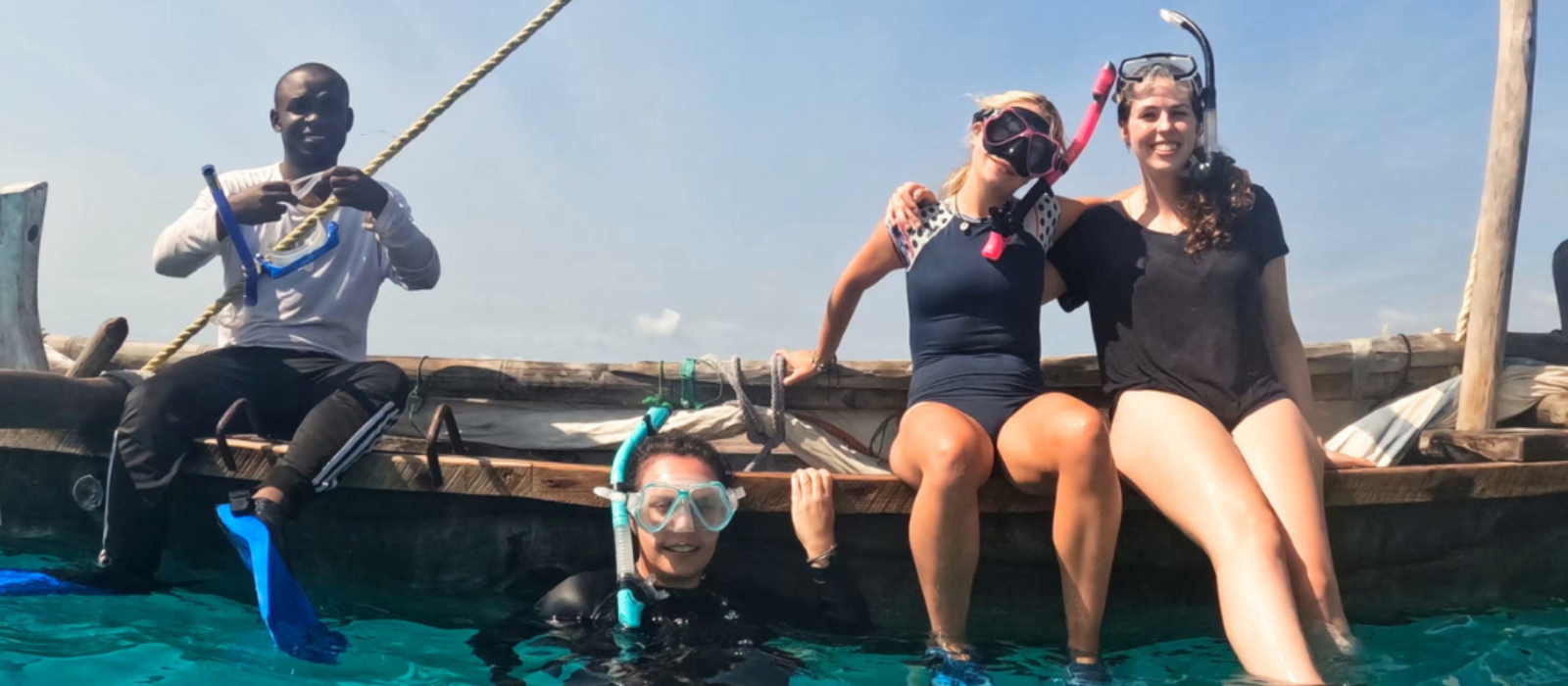 volunteers wearing snorkeling masks while on the sea
