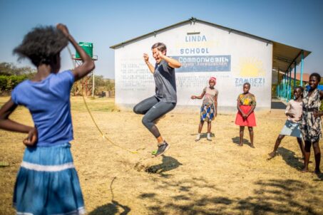 volunteer and kids playing outdoor