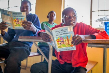 students reading their books