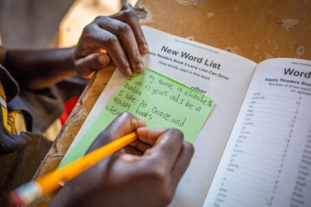 A student writing on a piece of paper