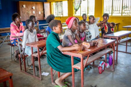 children sitting inside a classroom