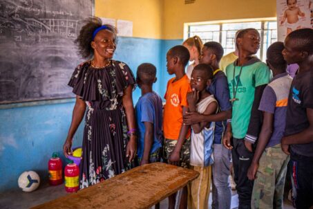 children falling in line in front of the classroom