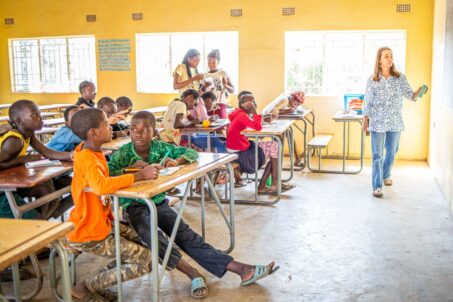 A teacher standing in front of her students