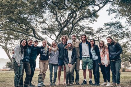 a group of individuals posing for a photoshoot