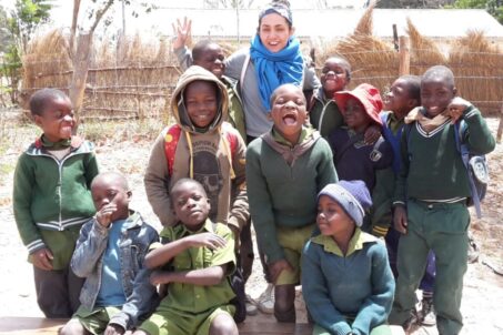 A volunteer interacting with local children