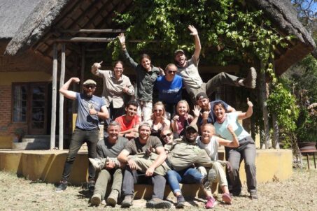 A group of individuals posing for a group selfie