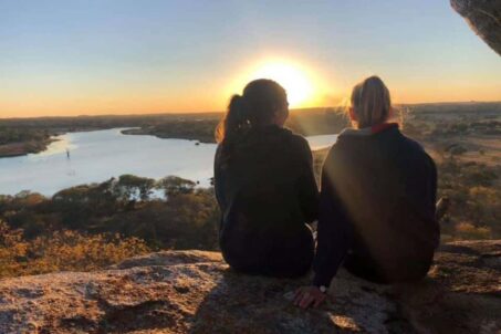 two women watching sunrise