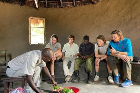 Volunteers sitting with local people